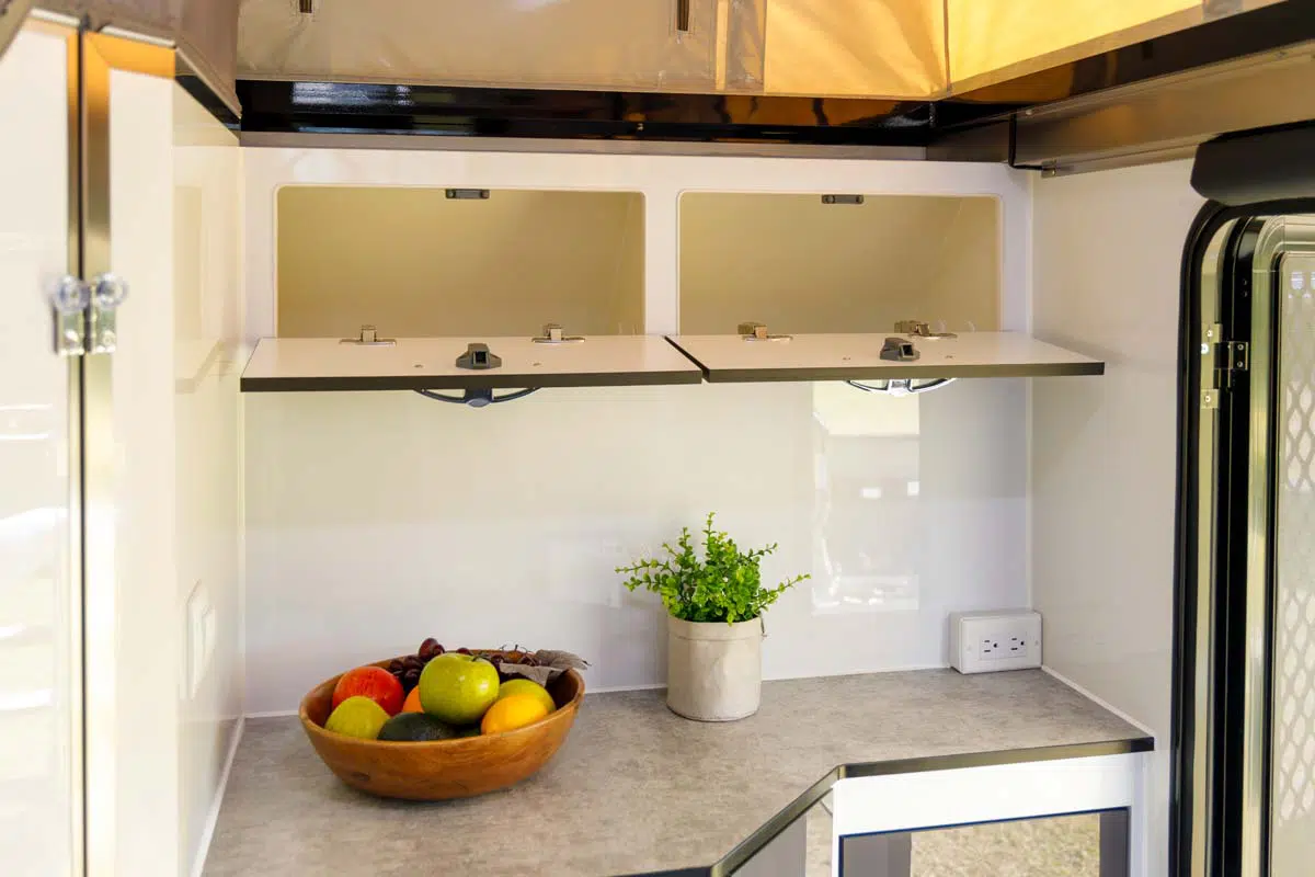 X13-offroad-caravan-internal-features-22-kitchen-bench-open-cupboards